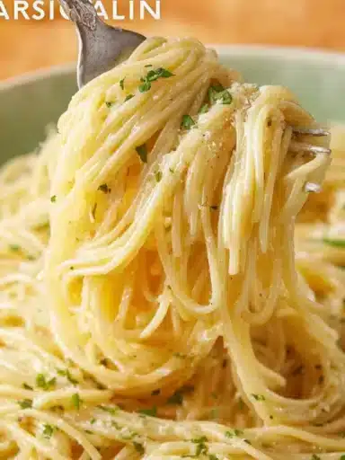 Creamy Garlic Parmesan Pasta topped with parsley and grated cheese