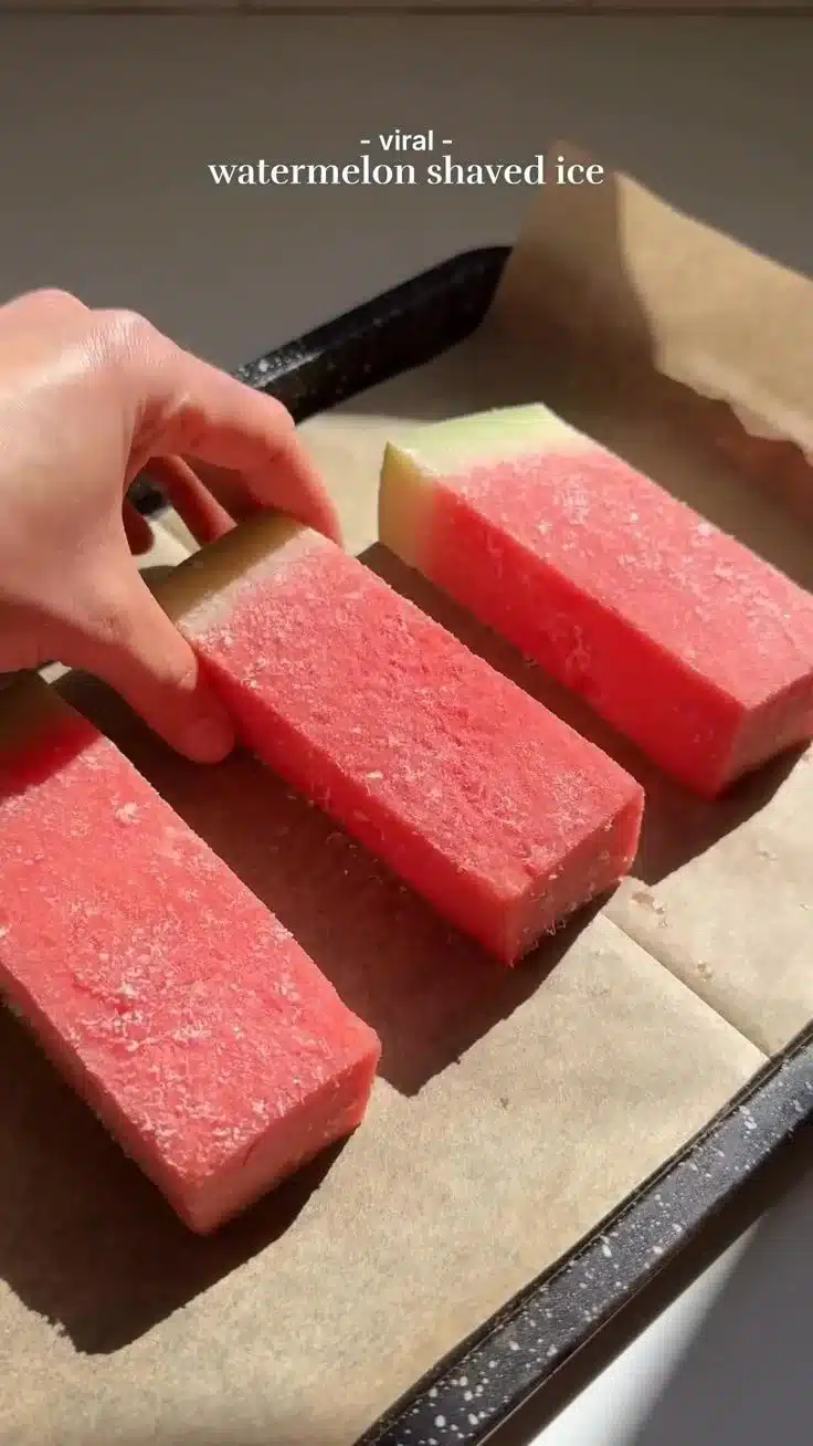 Viral watermelon shaved ice topped with fresh fruit and served in a colorful bowl