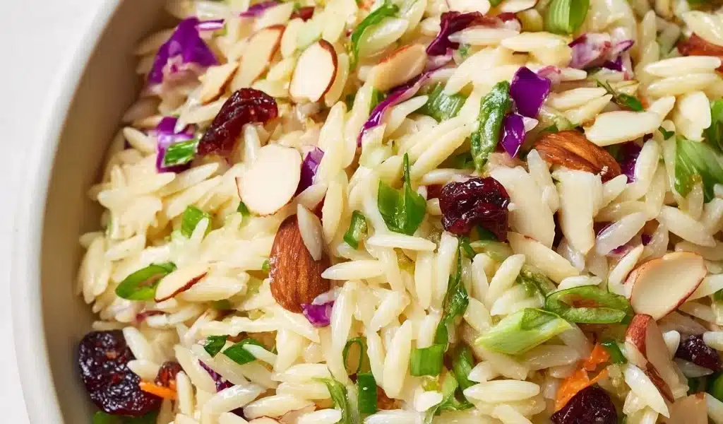 Coleslaw Orzo Salad Recipe: Refreshing and Easy Side Dish 8 Bowl of coleslaw orzo salad with fresh vegetables and dressing